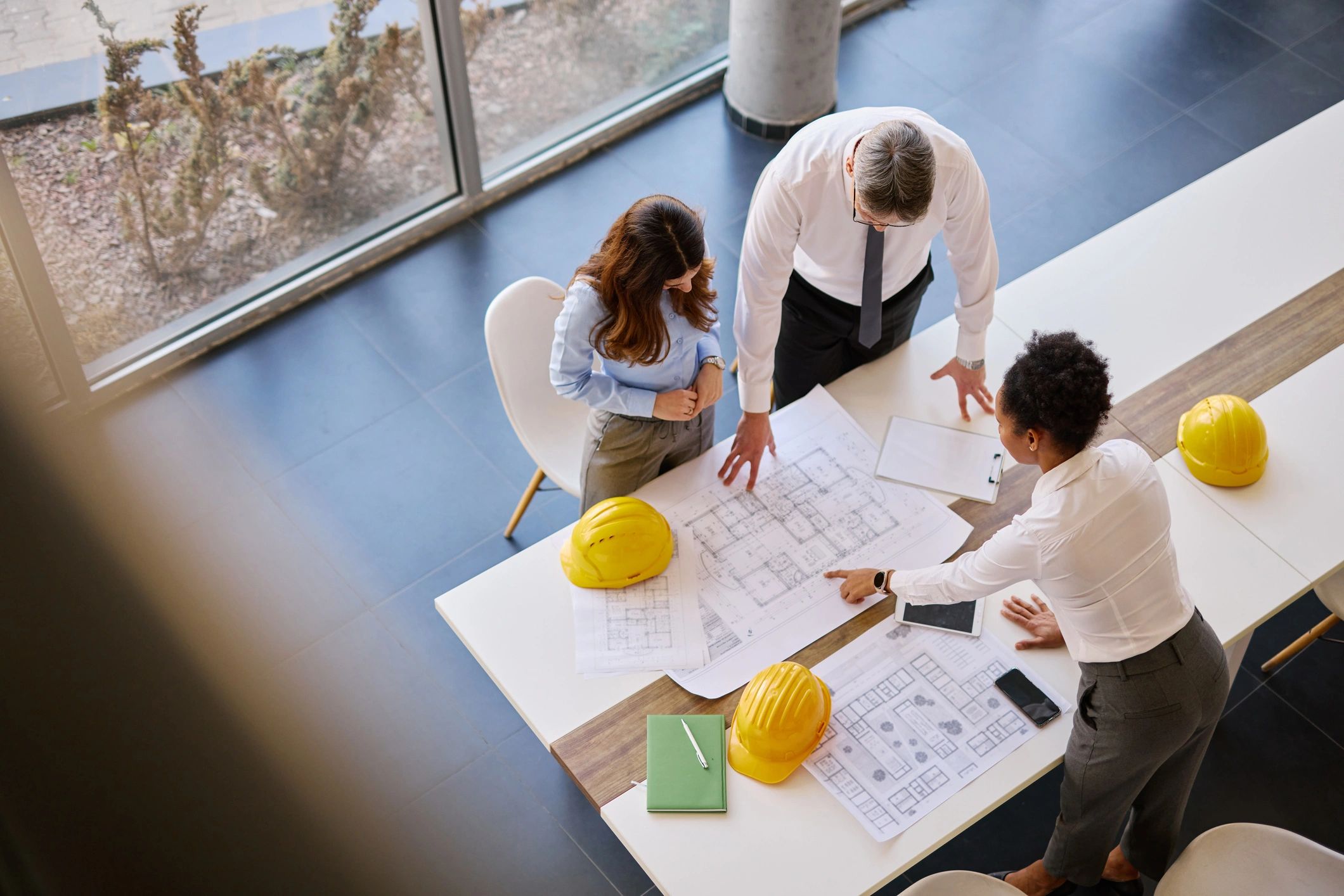 Construction team reviewing home plans